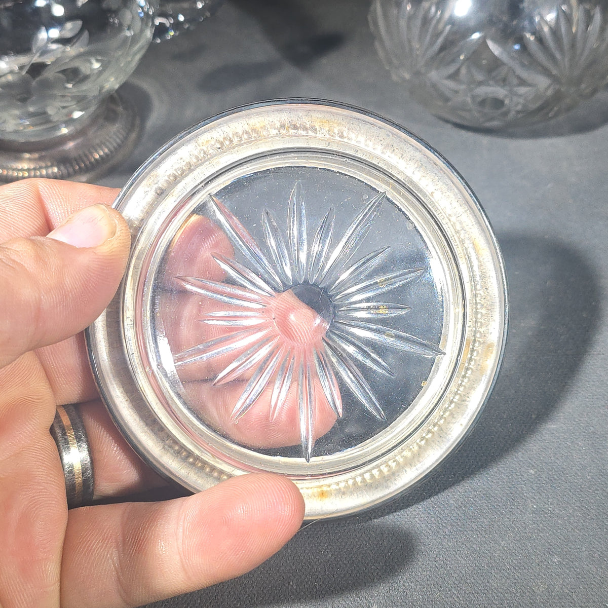 Grouping of Three Vintage Sterling Silver and Glass Tableware Pieces including Etched Two-Handled Sugar Bowl, Cut Glass Vanity Jar, and Glass Coaster
