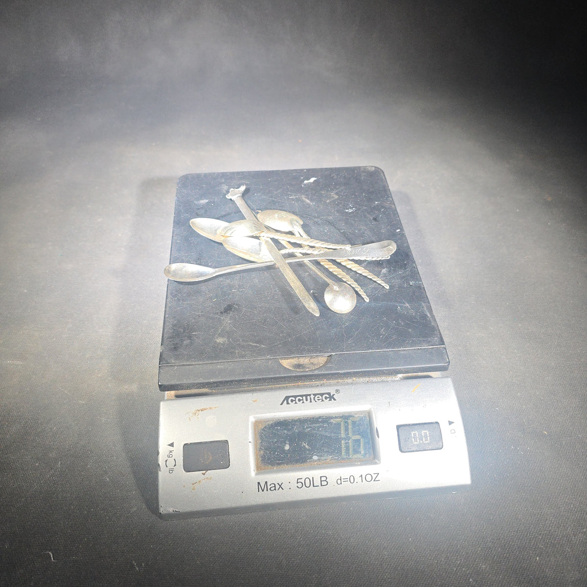Grouping of Eight Antique and Vintage Sterling Silver Pieces including Seven Demitasse Spoons and One Letter Opener
