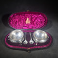 Lot 074 - Pair of Antique Sterling Silver Footed Salt Cellars with Salt Spoons in Presentation Case, Engraved Lions, Manufactured by Elkington & Co., Weight 146 g