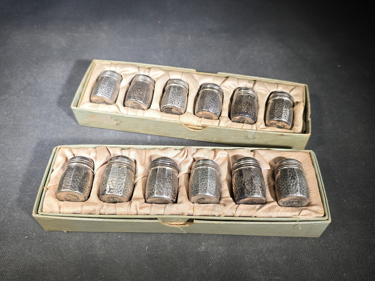 Grouping of 12 Sterling Silver Hammered Individual Salt and Pepper Shakers in Two Fitted Boxes, Arts and Crafts Style