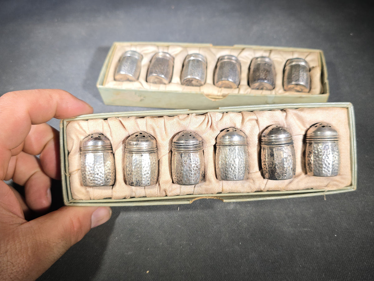 Grouping of 12 Sterling Silver Hammered Individual Salt and Pepper Shakers in Two Fitted Boxes, Arts and Crafts Style