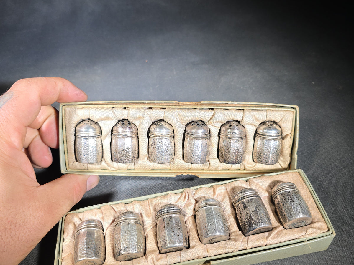 Grouping of 12 Sterling Silver Hammered Individual Salt and Pepper Shakers in Two Fitted Boxes, Arts and Crafts Style
