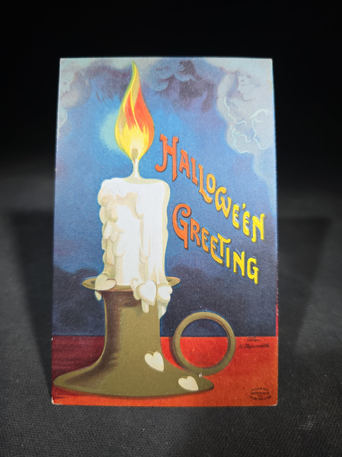 Antique Embossed "Hallowe'en Greeting" Postcard with Candle and Ghostly Faces, Illustrated by Ellen H. Clapsaddle, Published by International Art Publ. Co., Series No. 1393
