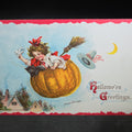 Lot 013 - Antique Embossed "Hallowe'en Greetings" Postcard Illustrated by Frances Brundage, Girl Riding Flying Pumpkin with Black Cat and Broomstick, Postcard Series No. 121, Printed in Germany