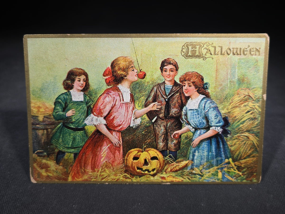Antique Embossed "Hallowe'en" Postcard with Children Bobbing for Apples and Jack-O-Lantern, Published by Raphael Tuck & Sons, Series No. 183, Printed in Saxony