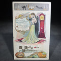 Lot 125 - Antique Embossed "A Jolly Halloween" Postcard with Couple Embracing by Grandfather Clock, Black Cat, Bat, Owl, and Jack-O-Lantern, Postmarked Reading, Pennsylvania, 1907