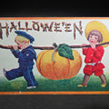 Lot 098 - Antique Embossed "Hallowe'en" Postcard with Two Children Carrying Large Pumpkin on a Stick, Published by International Art Publishing Co., New York and Berlin, 1908, Postmarked Hinckley, Maine