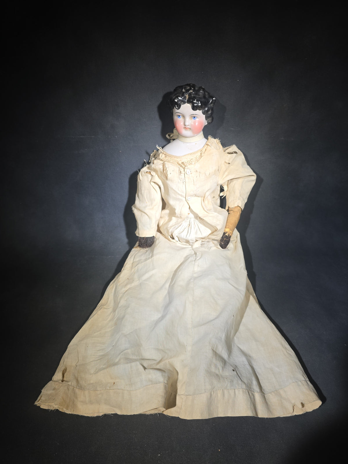 Antique China Head Doll with Molded Black Curly Hair, Cloth Body, and White Cotton Dress