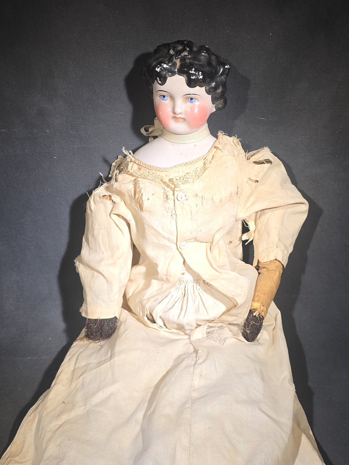 Antique China Head Doll with Molded Black Curly Hair, Cloth Body, and White Cotton Dress