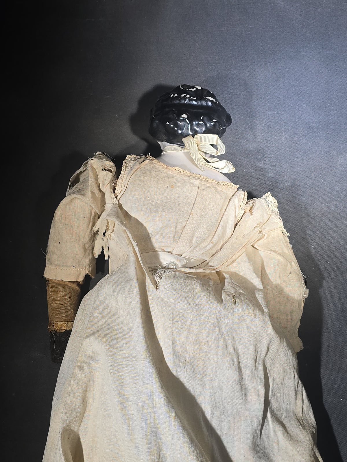 Antique China Head Doll with Molded Black Curly Hair, Cloth Body, and White Cotton Dress
