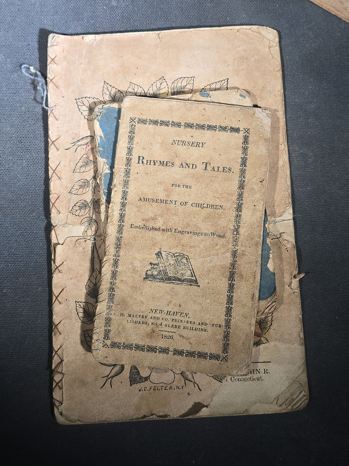 Grouping of Antique Chapbooks, Primers, and Children's Books including "Nursery Rhymes and Tales" 1826, "The Children in the Wood" 1830, "Courtship and Marriage" 1824, and "Watts Songs Against Faults" by McLoughlin Bros.