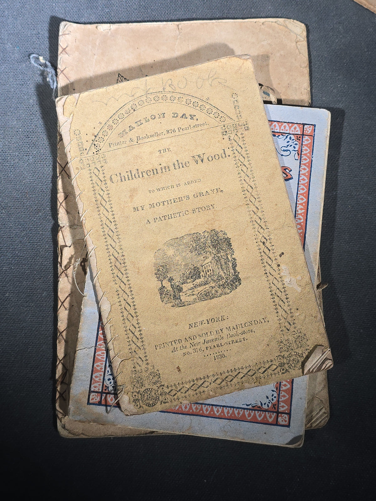 Grouping of Antique Chapbooks, Primers, and Children's Books including "Nursery Rhymes and Tales" 1826, "The Children in the Wood" 1830, "Courtship and Marriage" 1824, and "Watts Songs Against Faults" by McLoughlin Bros.