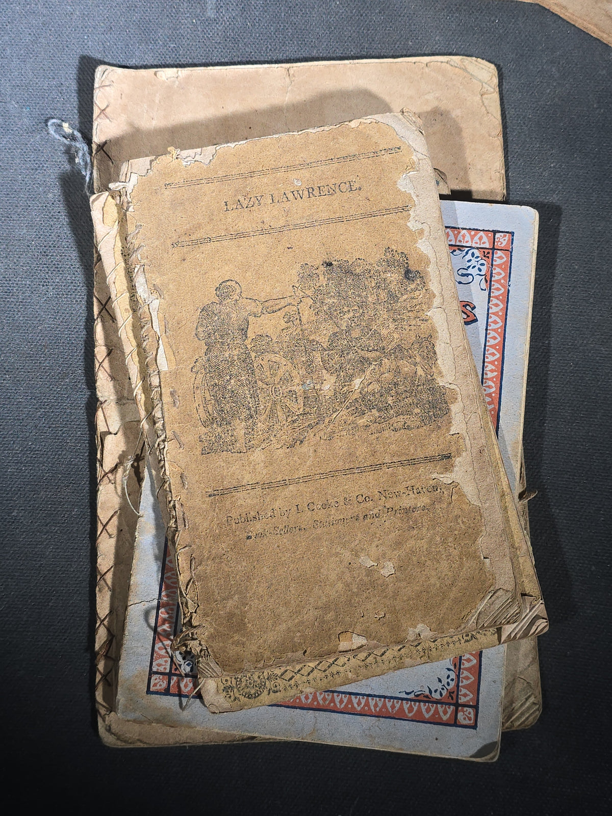 Grouping of Antique Chapbooks, Primers, and Children's Books including "Nursery Rhymes and Tales" 1826, "The Children in the Wood" 1830, "Courtship and Marriage" 1824, and "Watts Songs Against Faults" by McLoughlin Bros.
