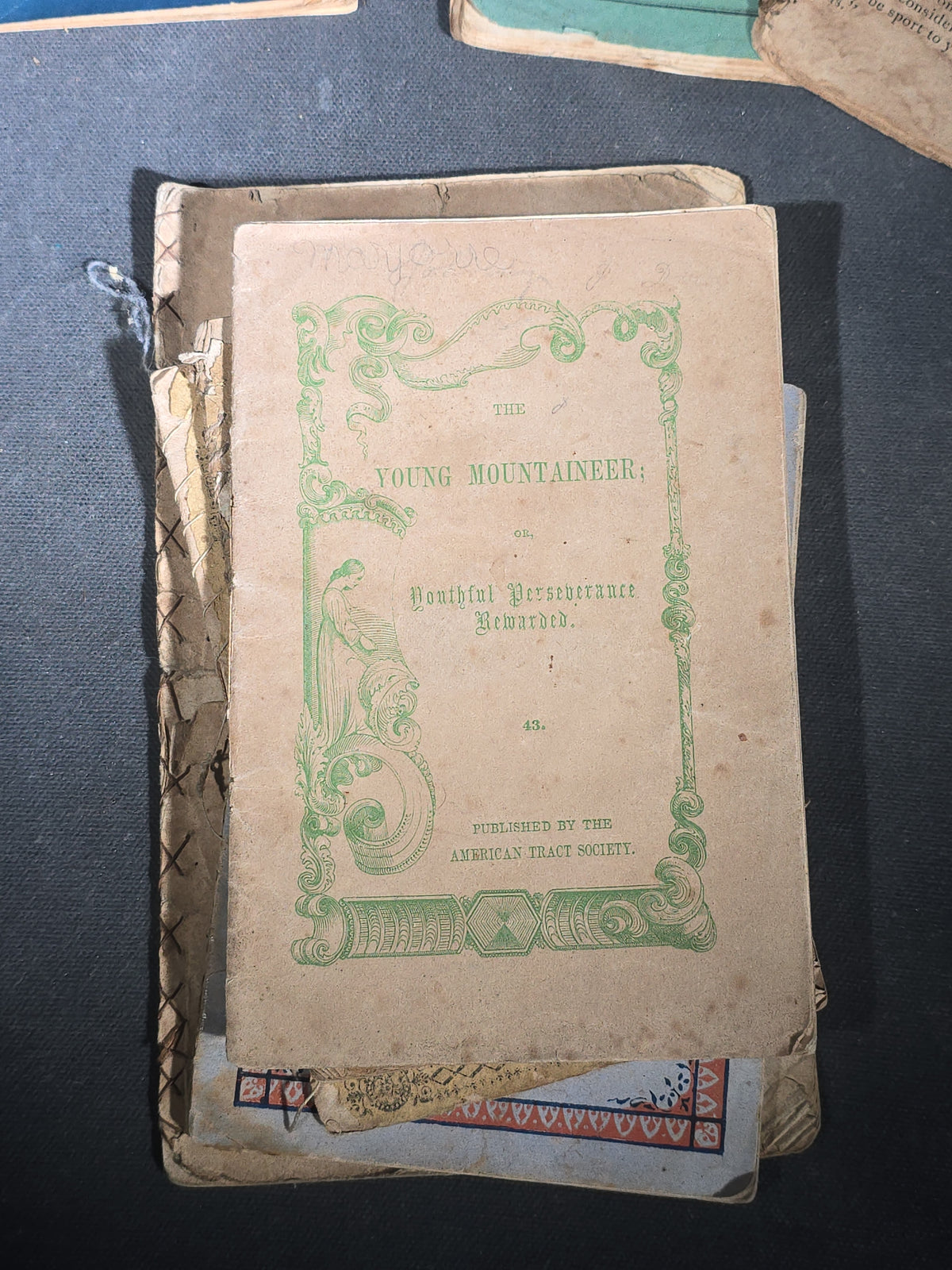 Grouping of Antique Chapbooks, Primers, and Children's Books including "Nursery Rhymes and Tales" 1826, "The Children in the Wood" 1830, "Courtship and Marriage" 1824, and "Watts Songs Against Faults" by McLoughlin Bros.