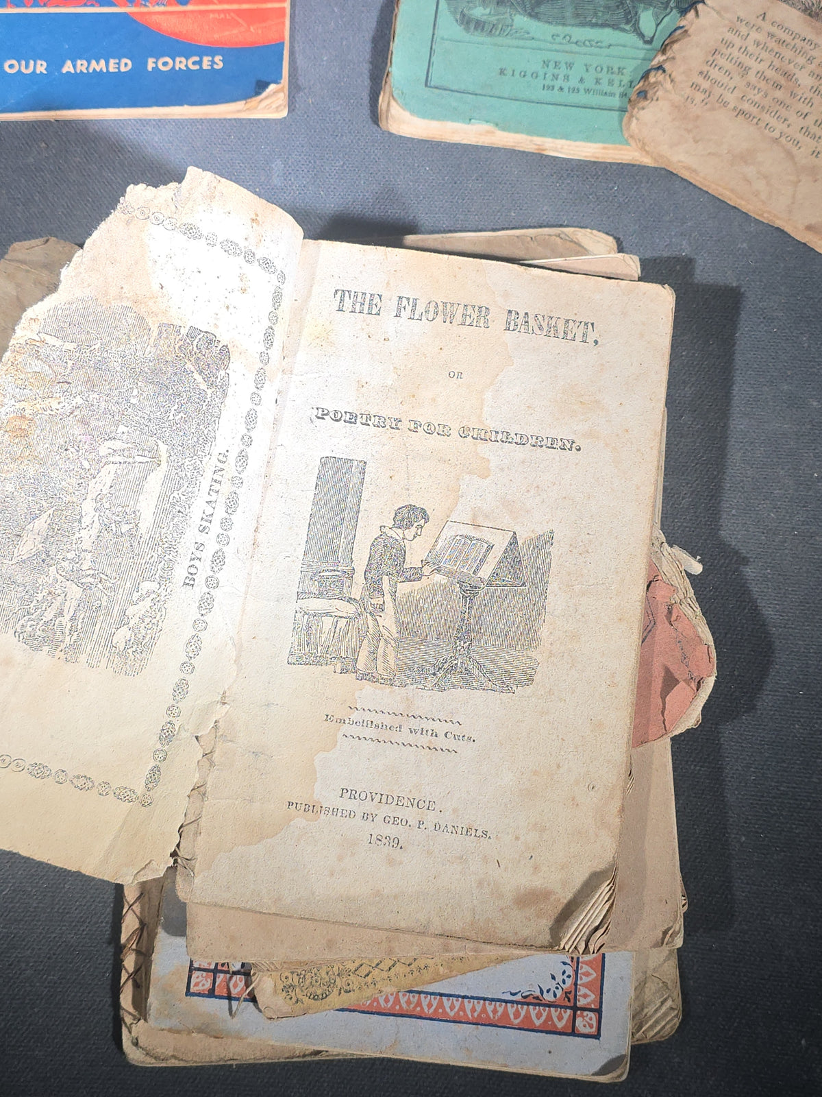 Grouping of Antique Chapbooks, Primers, and Children's Books including "Nursery Rhymes and Tales" 1826, "The Children in the Wood" 1830, "Courtship and Marriage" 1824, and "Watts Songs Against Faults" by McLoughlin Bros.