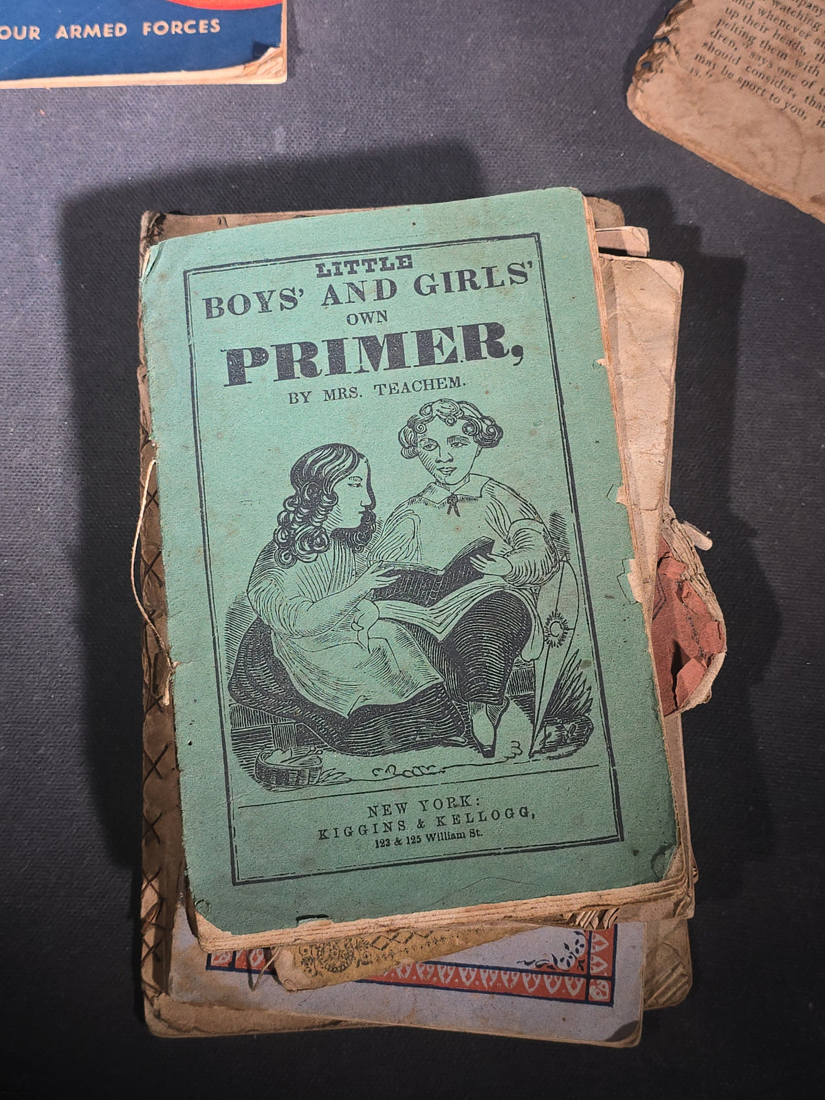 Grouping of Antique Chapbooks, Primers, and Children's Books including "Nursery Rhymes and Tales" 1826, "The Children in the Wood" 1830, "Courtship and Marriage" 1824, and "Watts Songs Against Faults" by McLoughlin Bros.