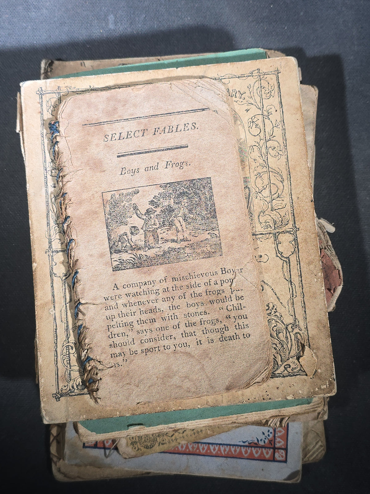 Grouping of Antique Chapbooks, Primers, and Children's Books including "Nursery Rhymes and Tales" 1826, "The Children in the Wood" 1830, "Courtship and Marriage" 1824, and "Watts Songs Against Faults" by McLoughlin Bros.