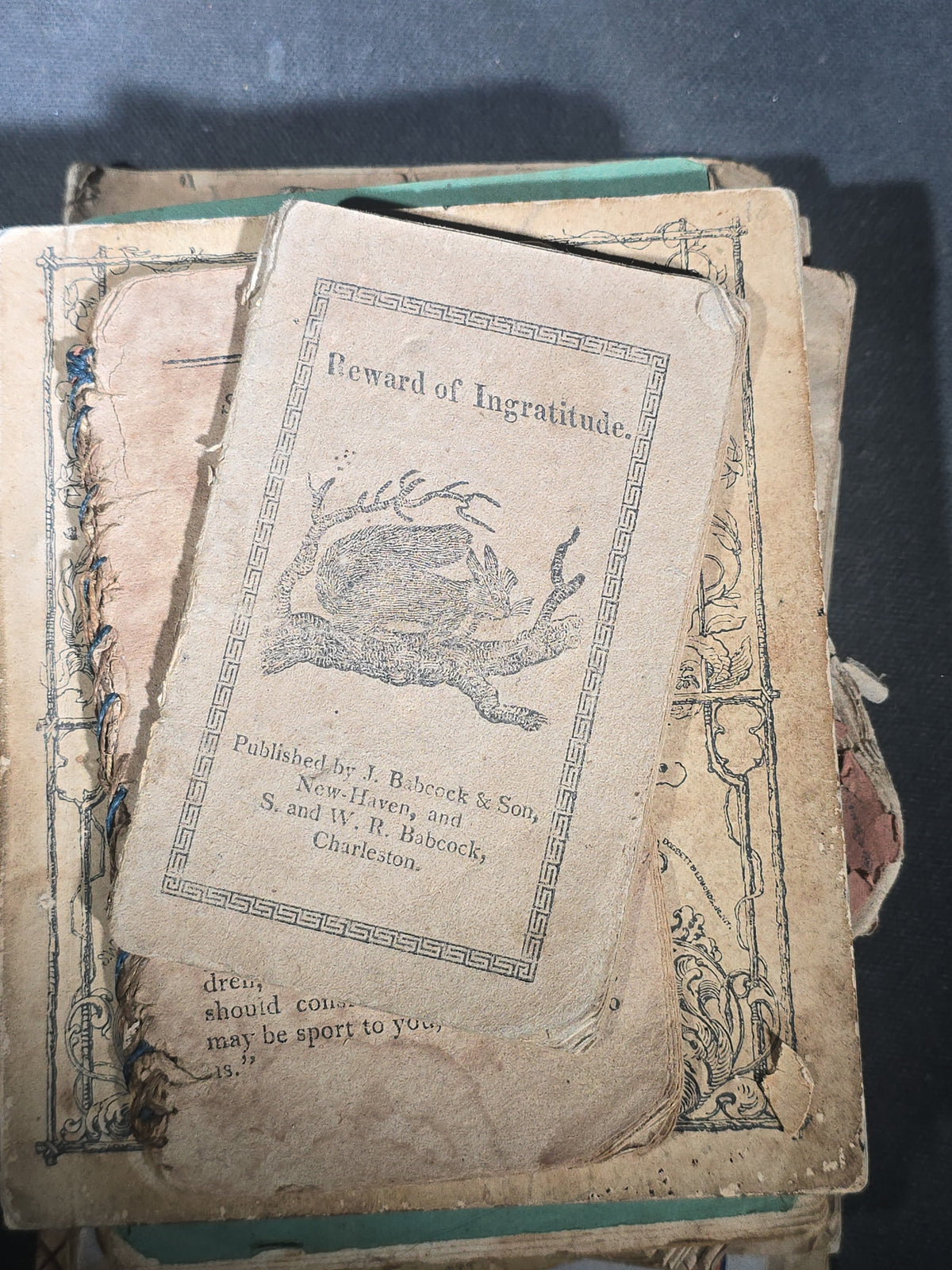 Grouping of Antique Chapbooks, Primers, and Children's Books including "Nursery Rhymes and Tales" 1826, "The Children in the Wood" 1830, "Courtship and Marriage" 1824, and "Watts Songs Against Faults" by McLoughlin Bros.