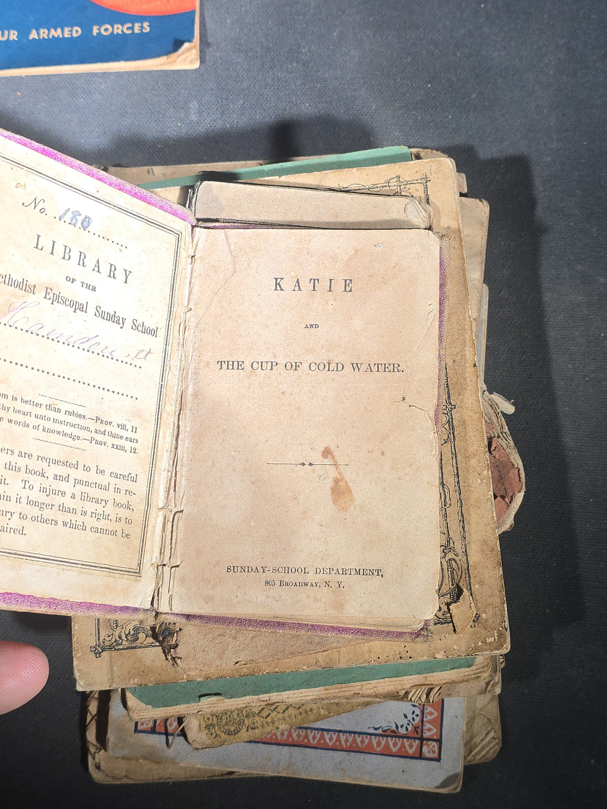 Grouping of Antique Chapbooks, Primers, and Children's Books including "Nursery Rhymes and Tales" 1826, "The Children in the Wood" 1830, "Courtship and Marriage" 1824, and "Watts Songs Against Faults" by McLoughlin Bros.