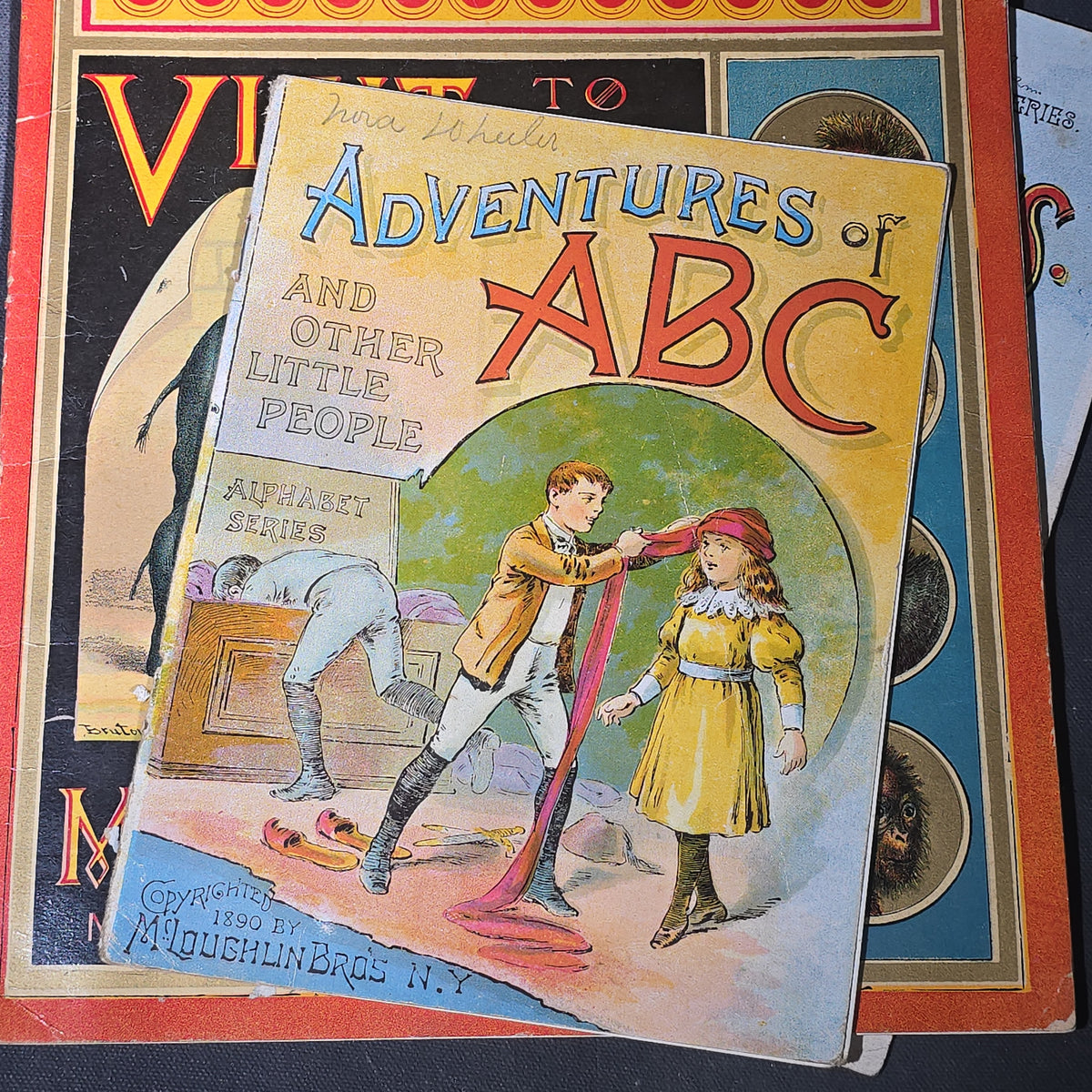 Grouping of 14 Antique Chromolithograph Children's Books Including "Circus Sights," "Visit to the Menagerie," "Adventures of ABC," "Christmas Delights," "Cock Robin," And "The Little Old Woman," Published by Mcloughlin Bros., New York