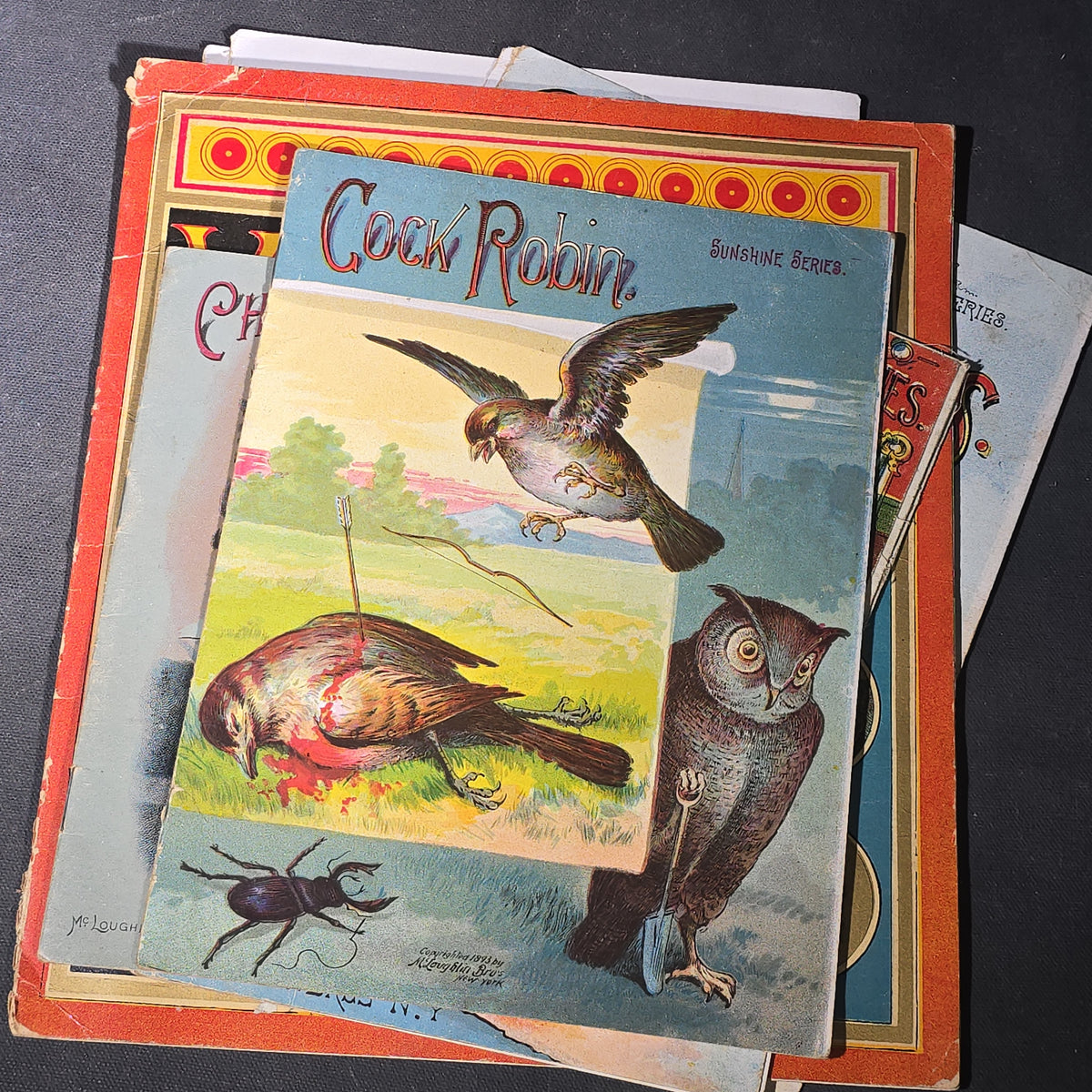 Grouping of 14 Antique Chromolithograph Children's Books Including "Circus Sights," "Visit to the Menagerie," "Adventures of ABC," "Christmas Delights," "Cock Robin," And "The Little Old Woman," Published by Mcloughlin Bros., New York