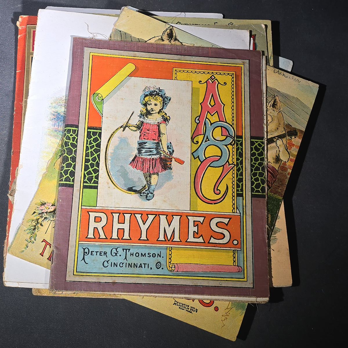 Grouping of 14 Antique Chromolithograph Children's Books Including "Circus Sights," "Visit to the Menagerie," "Adventures of ABC," "Christmas Delights," "Cock Robin," And "The Little Old Woman," Published by Mcloughlin Bros., New York
