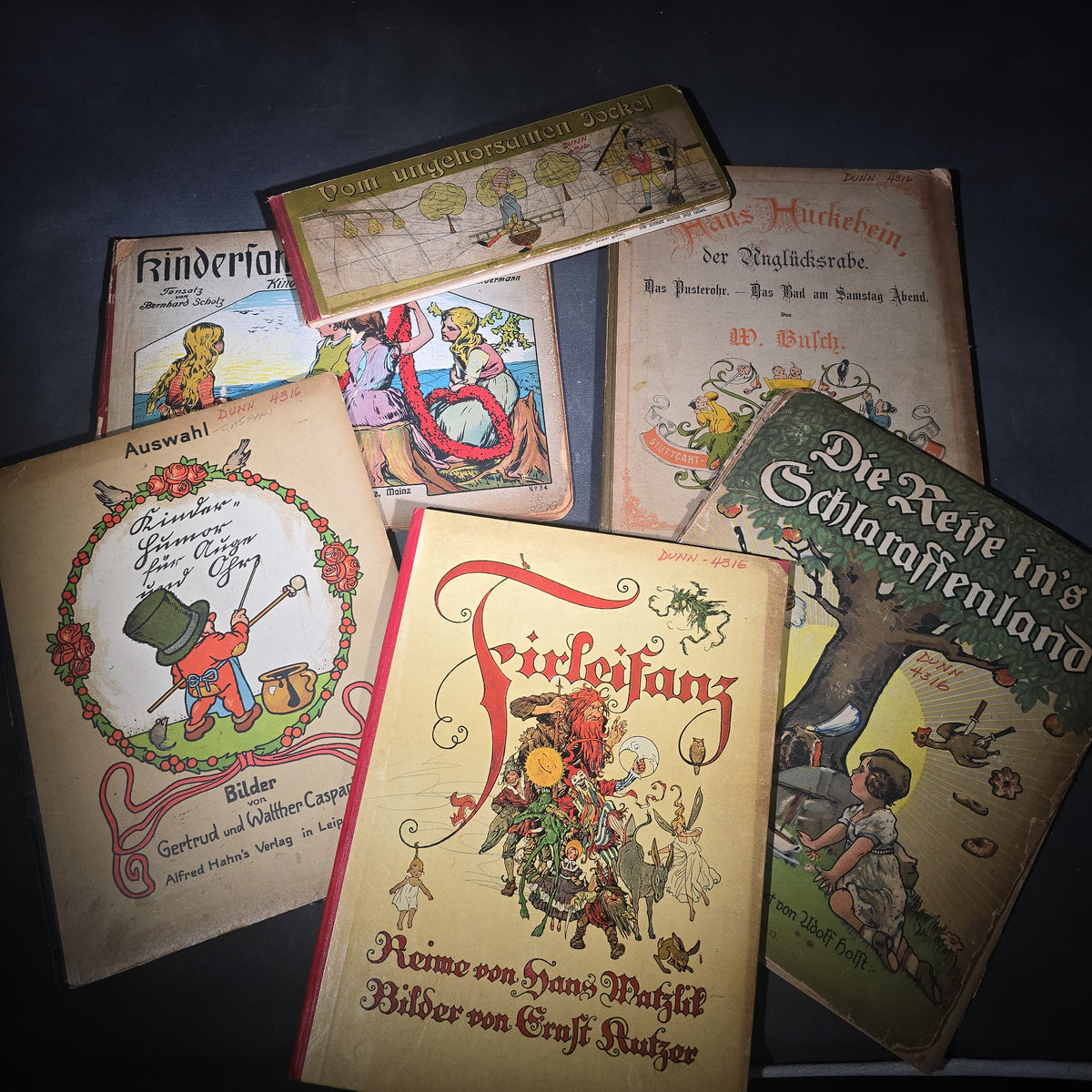 Grouping of Six Antique and Vintage German Illustrated Children's Books including "Firlefanz" ("Tomfoolery") by Hans Watzlik and Ernst Kutzer 1922, "Hans Huckebein, der Ungluecksrabe" by W. Busch, and "Die Reise in's Schlaraffenland"