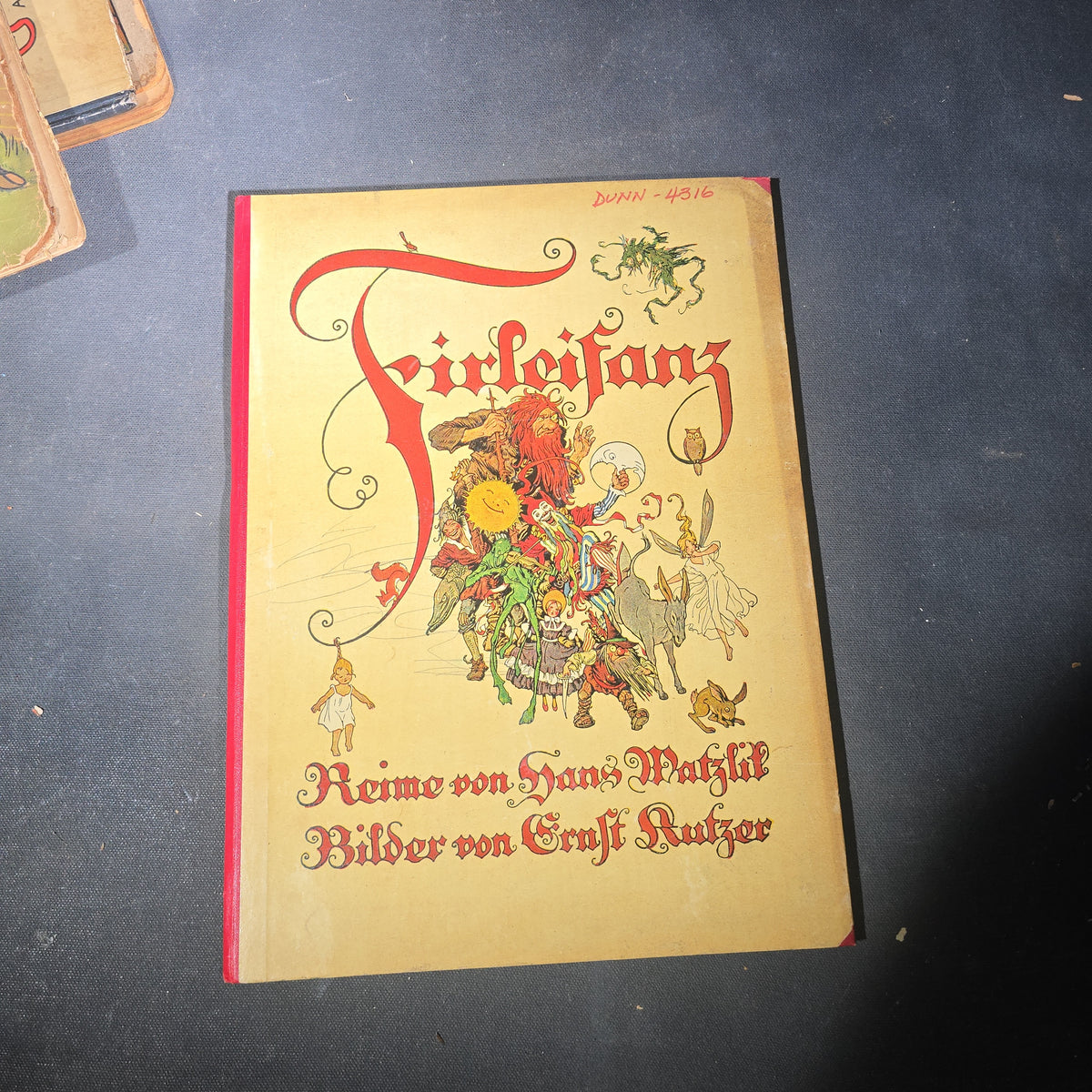 Grouping of Six Antique and Vintage German Illustrated Children's Books including "Firlefanz" ("Tomfoolery") by Hans Watzlik and Ernst Kutzer 1922, "Hans Huckebein, der Ungluecksrabe" by W. Busch, and "Die Reise in's Schlaraffenland"