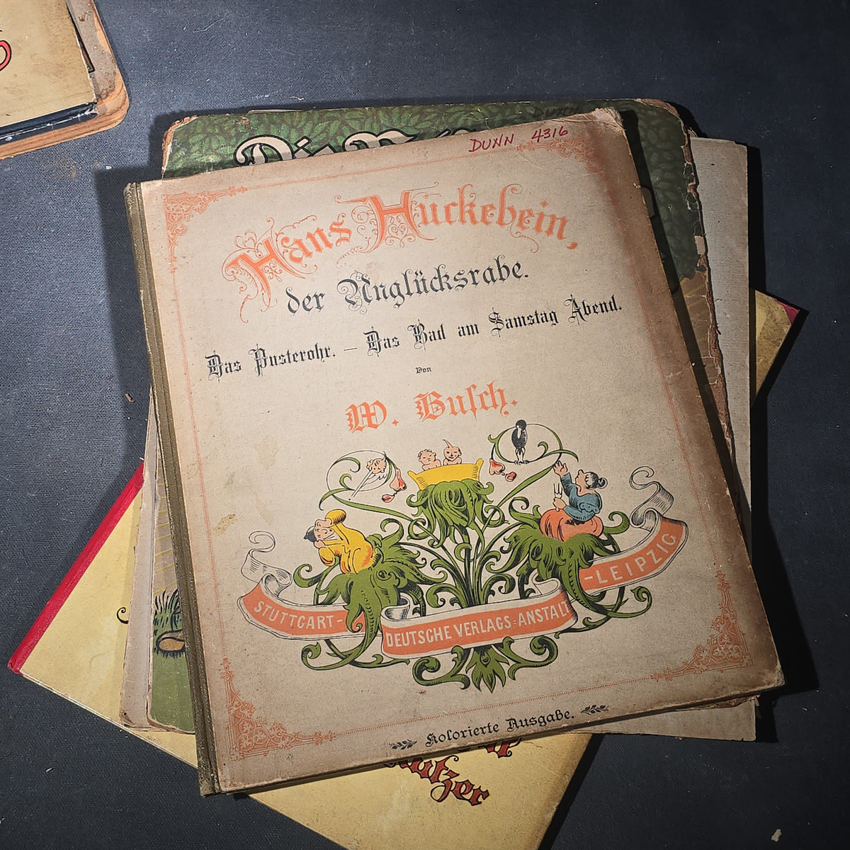 Grouping of Six Antique and Vintage German Illustrated Children's Books including "Firlefanz" ("Tomfoolery") by Hans Watzlik and Ernst Kutzer 1922, "Hans Huckebein, der Ungluecksrabe" by W. Busch, and "Die Reise in's Schlaraffenland"