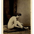 Lot 001 - Antique Carte De Visite C.D.V. Nude Photograph of a Woman Seated on a Striped Mattress Putting on Shoes