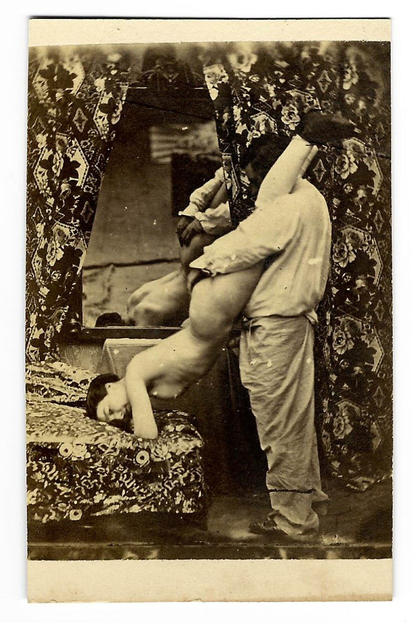 Antique Risque Carte de Visite C.D.V. Photograph of a Man and Woman Engaged in a Sex Act Before a Mirror with Floral Drapery Backdrop