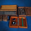 Lot 204 - Grouping of Four Vintage and Antique Wooden-Boxed Machinist Tool Sets Including Countersink Set, Taps and Dies, Number Stamps, and Alameda Gauge Co. Tool