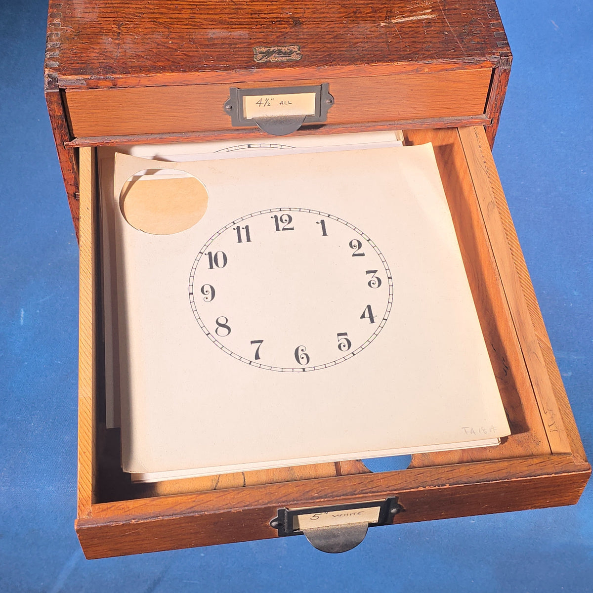 Vintage Oak Five-Drawer Cabinet with Clock Repair Paper Dial Faces including Ansonia, Sessions, and Ingraham