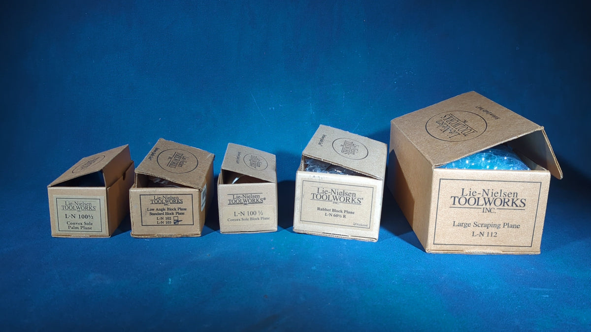 Grouping of Five Modern Lie-Nielsen Toolworks Hand Planes, Brand New in Boxes, including L-N 103 Low Angle Block Plane, L-N 112 Large Scraping Plane, L-N 100 1/2 Convex Sole Block Plane and Palm Plane, and L-N 60 1/2 R Rabbet Block Plane