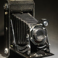 Lot 065 - Vintage Six-20 Kodak Folding Camera in Black with Focusing Doublet Lens 272, Original Box, and Paperwork, Manufactured by Eastman Kodak Co., Rochester, New York