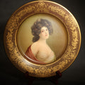 Lot 084 - Antique Vienna Art Plates Tin Lithograph Portrait Plate, Young Woman in a Red Drape, Gilt Arabesque Border, Patented February 21, 1905, 10-1/8" L x 10-1/8" H