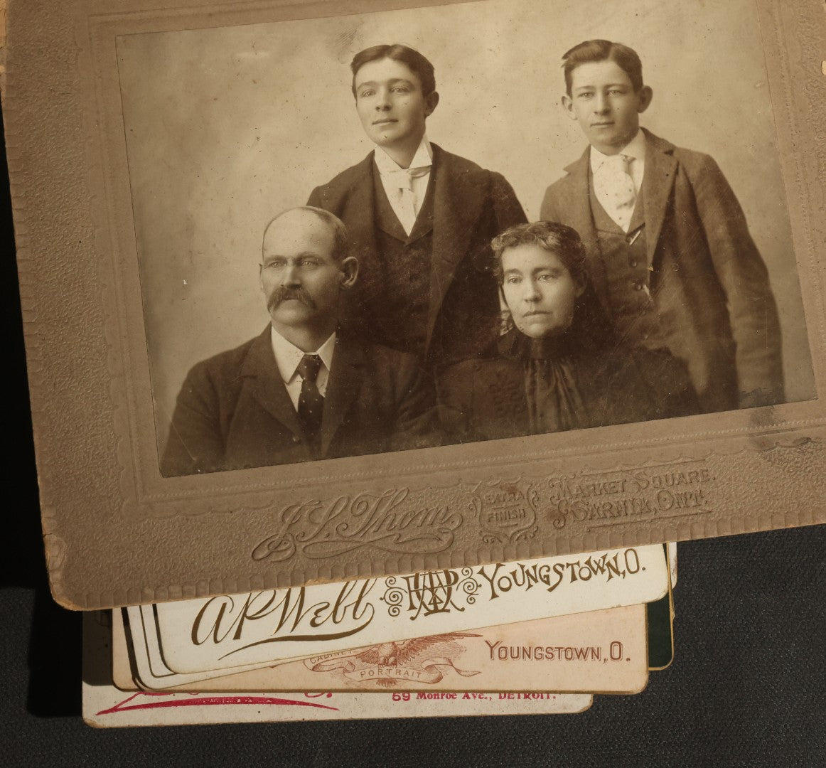 Grouping of 30+ Antique Cabinet Card Photographs of Men, Women, Children, and Families Including Photographers from Oberlin, Ohio, Youngstown, Ohio, West Lafayette, Indiana, Kalamazoo, Michigan, and Detroit, Michigan