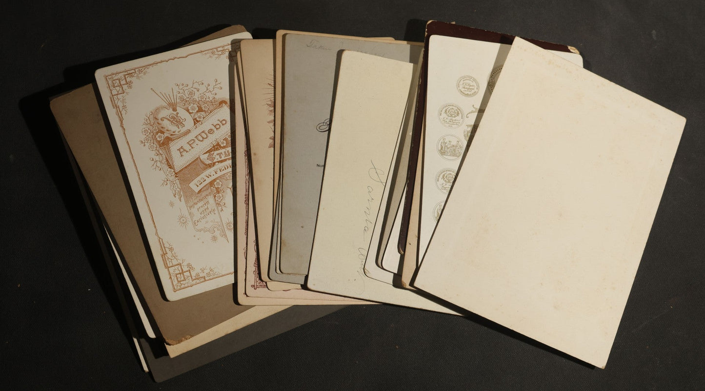 Grouping of 30+ Antique Cabinet Card Photographs of Men, Women, Children, and Families Including Photographers from Oberlin, Ohio, Youngstown, Ohio, West Lafayette, Indiana, Kalamazoo, Michigan, and Detroit, Michigan