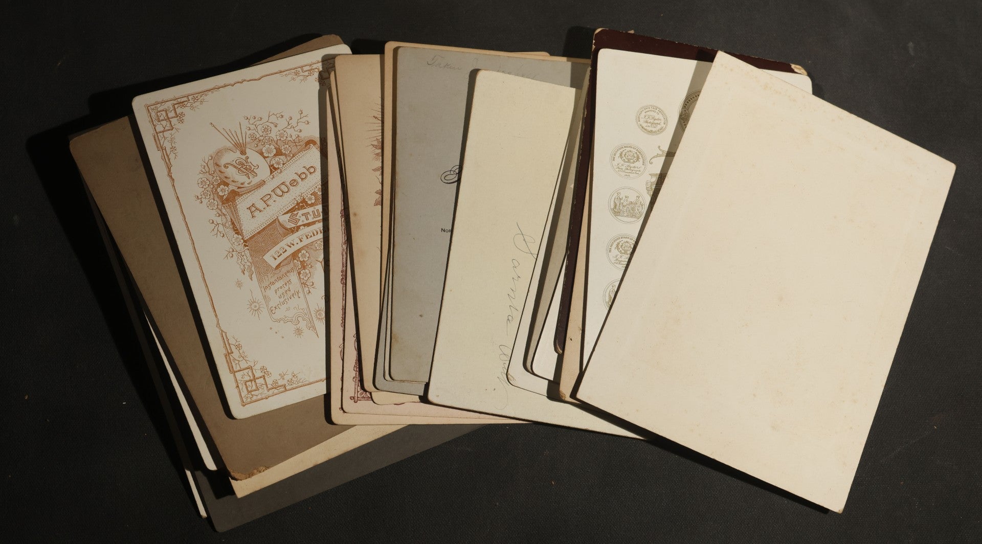 Grouping of 30+ Antique Cabinet Card Photographs of Men, Women, Children, and Families Including Photographers from Oberlin, Ohio, Youngstown, Ohio, West Lafayette, Indiana, Kalamazoo, Michigan, and Detroit, Michigan
