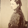 Lot 123 - Antique Tintype Photograph of a Young Girl in Profile with Long Wavy Hair and a Dark Hair Bow, Hand-Tinted Cheeks