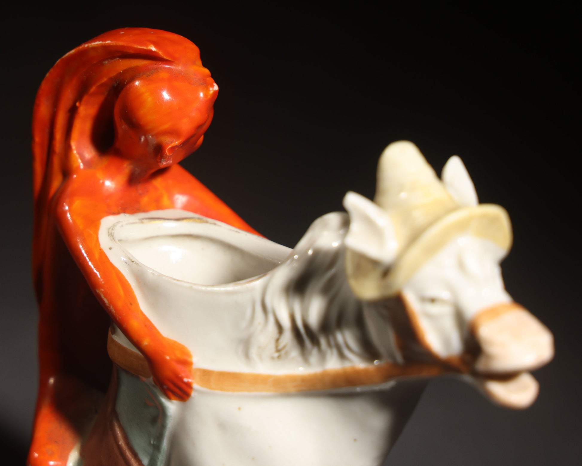 Antique Porcelain Figural Creamer of a Red Devil Riding a White Horse, Likely German, Note Horse Missing Tip of Ear