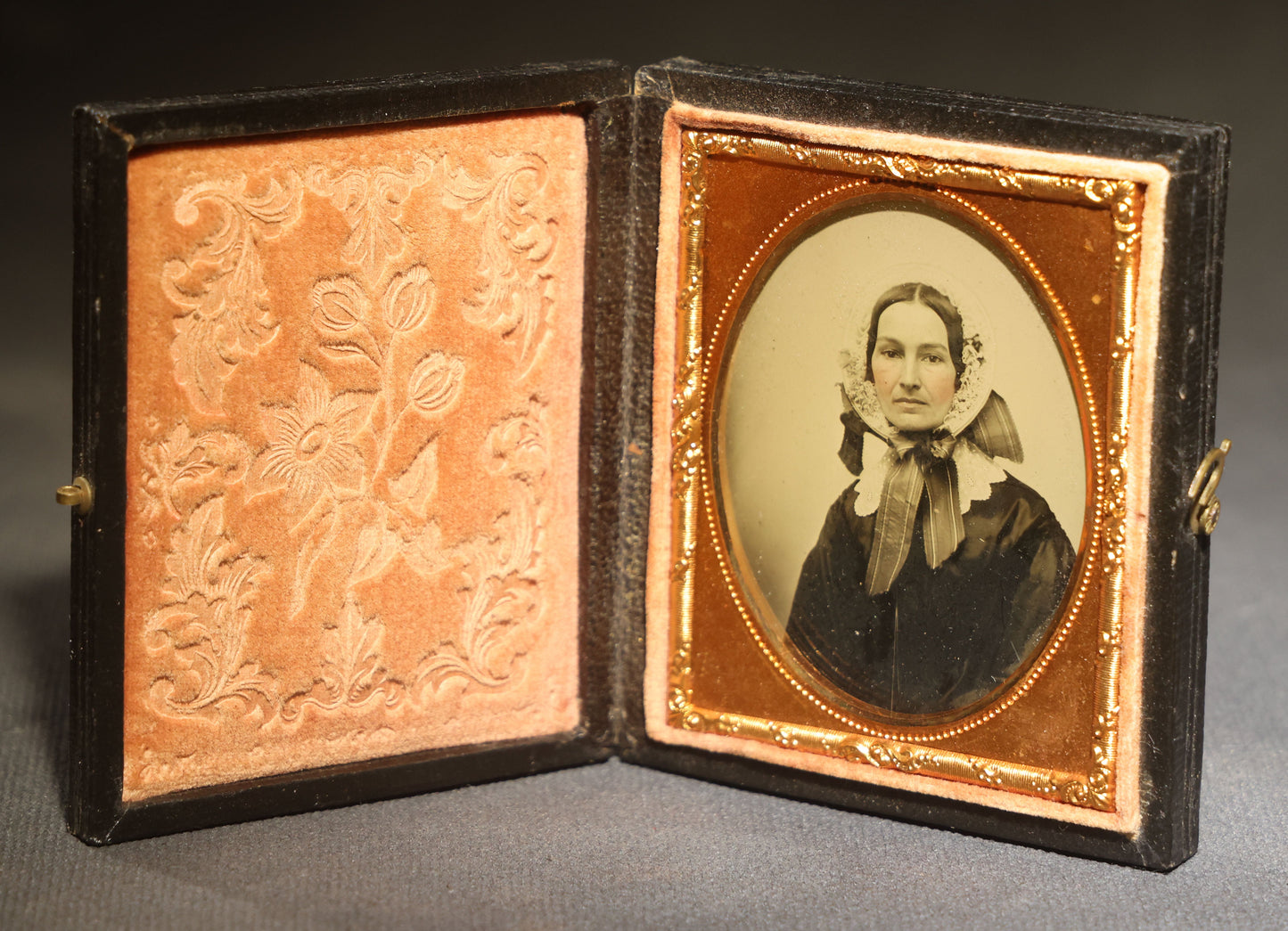 Antique 1/9th Plate Ambrotype Photograph of a Middle-Aged Woman in a Bonnet and Dark Dress, Full Intact Leatherette Case