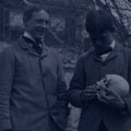Lot 061 - Single Antique Glass Negative Plate, Man Holding Real Human Skull, With Grinning Man To Left, In Front Of House, Note Edge Cracks (First Photo Is Inverted)