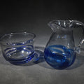Lot 094 - Pair of Vintage Signed Art Glass Creamer and Sugar Bowl with Blue Swirl Design