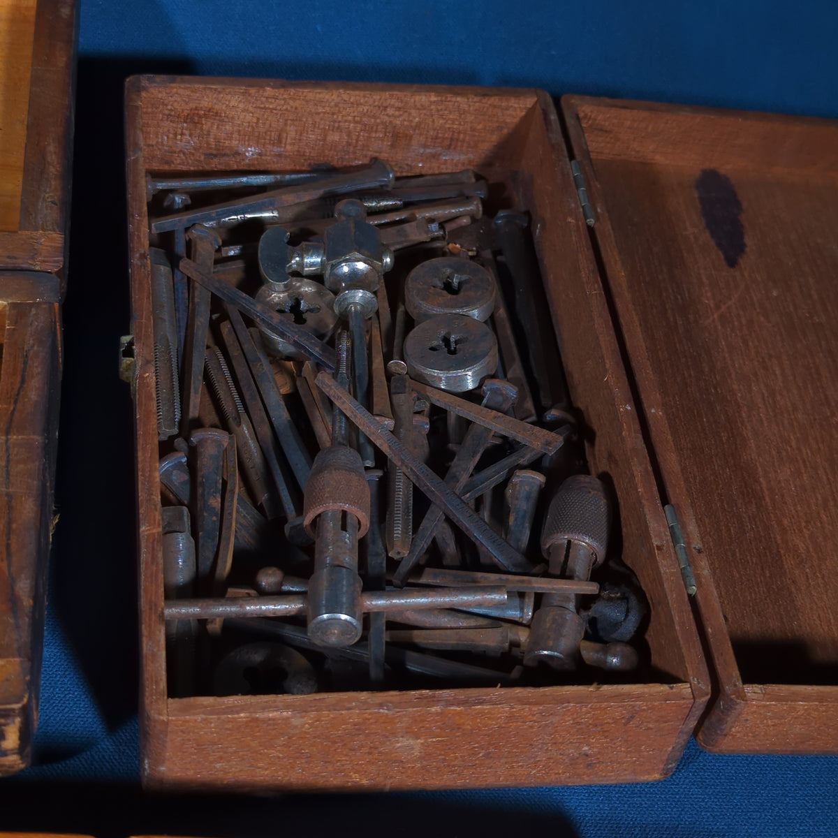 Grouping of Four Vintage and Antique Wooden-Boxed Machinist Tool Sets including Countersink Set, Taps and Dies, Number Stamps, and Alameda Gauge Co. Tool