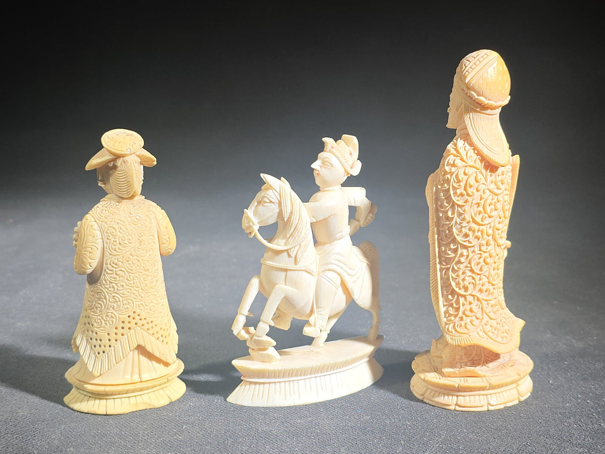 Trio of Antique Carved Ivory Chess Pieces including King, Queen, and Knight