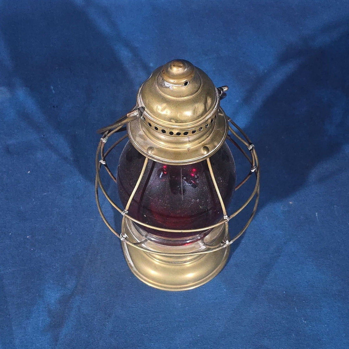 Antique Brass Lantern with Red Globe and Wire Cage Guard