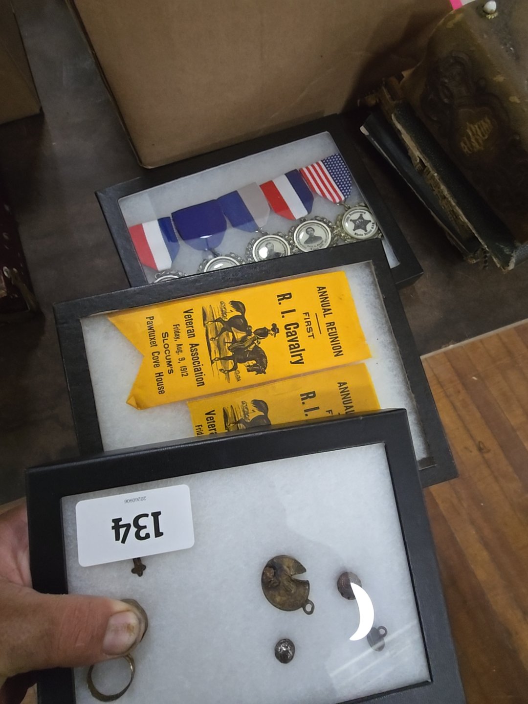grouping of three Riker cases with artifacts and modern reproduction medals