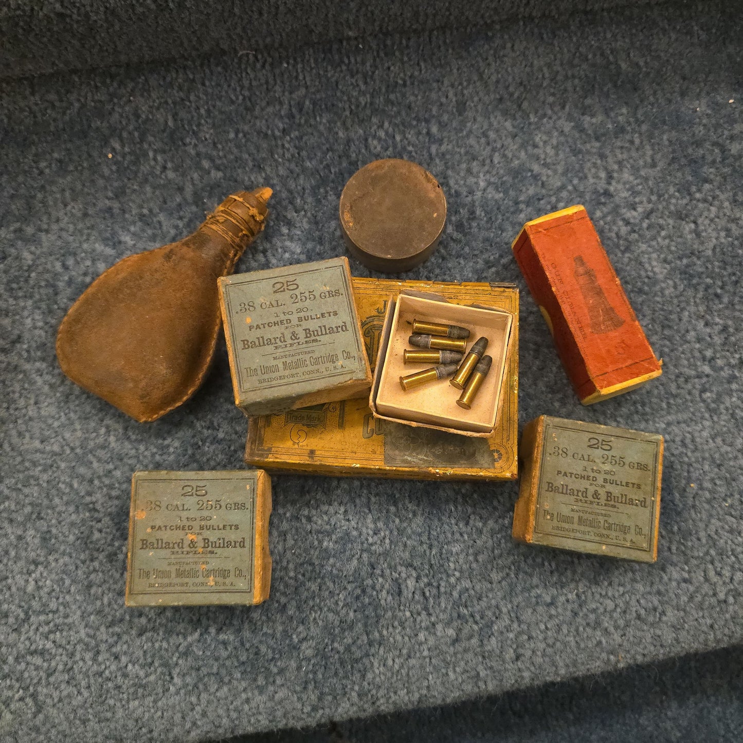 Grouping of Antique and Vintage Ammunition Boxes with Contents and Gun Accessories including Winchester .40-72 Cartridges for Model 1895, Union Metallic Cartridge Co. Ballard & Bullard Bullets, and Colt Grip Panel