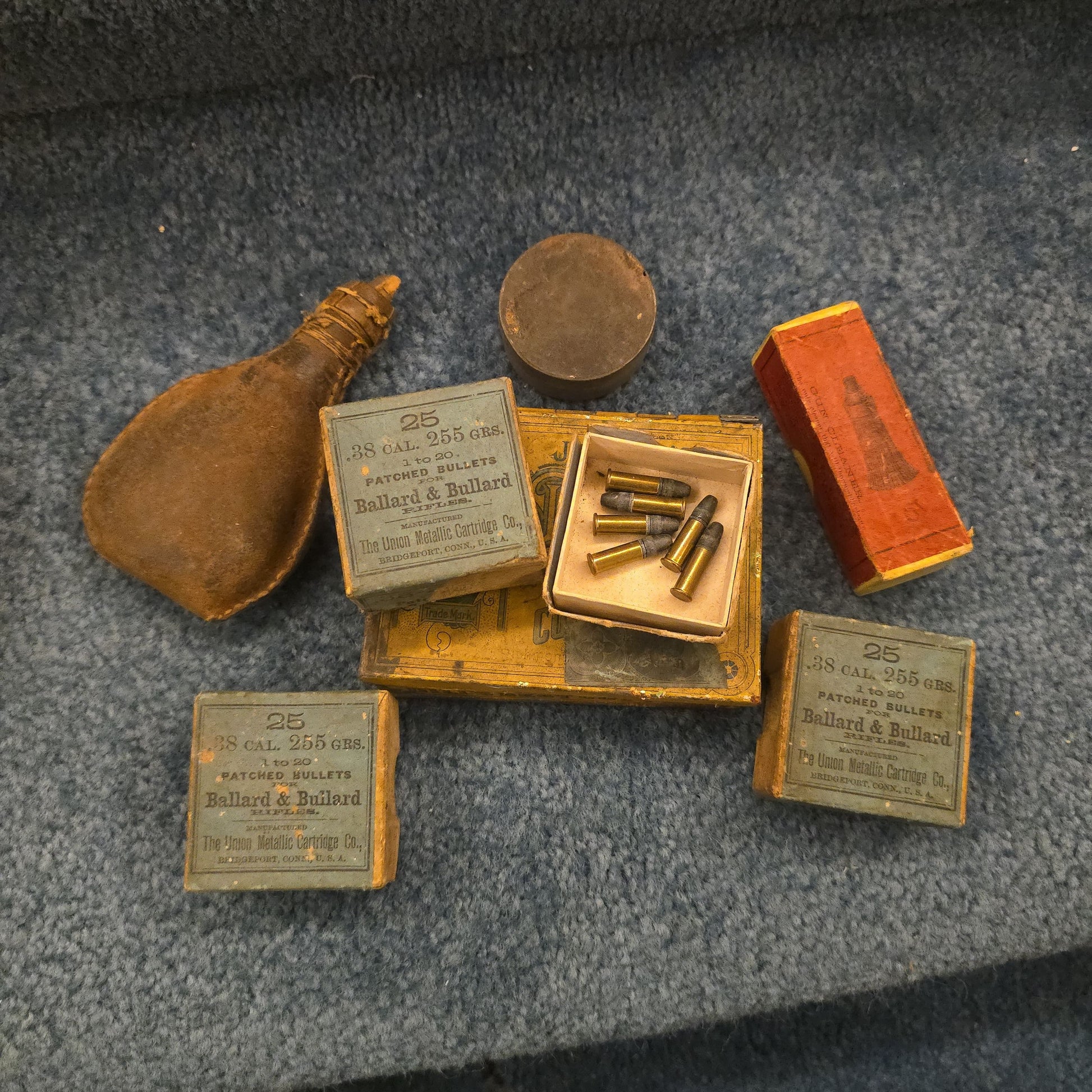 Grouping of Antique and Vintage Ammunition Boxes with Contents and Gun Accessories including Winchester .40-72 Cartridges for Model 1895, Union Metallic Cartridge Co. Ballard & Bullard Bullets, and Colt Grip Panel